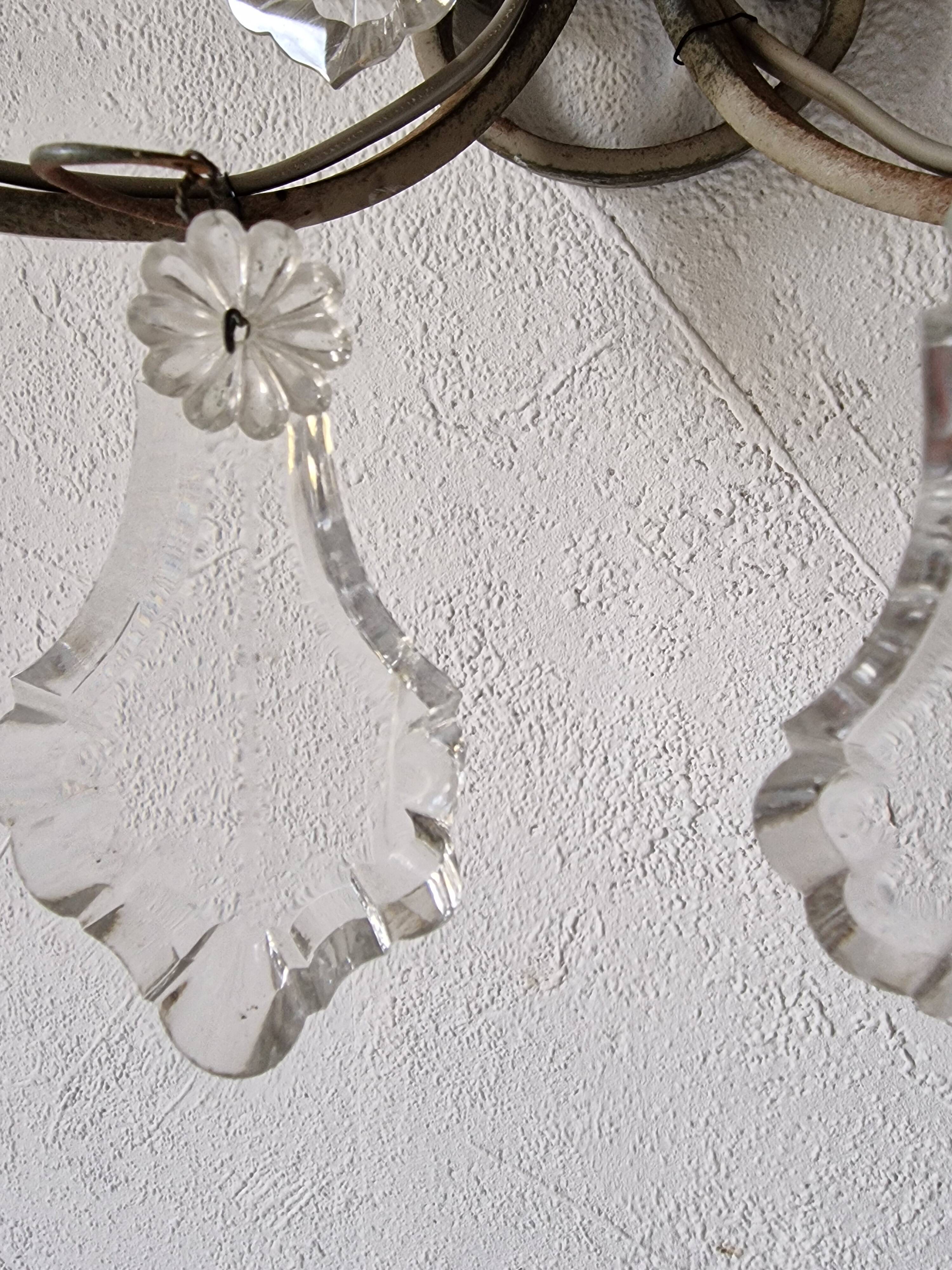 Pair of sconces in patinated metal and crystal tassels