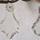 Pair of sconces in patinated metal and crystal tassels