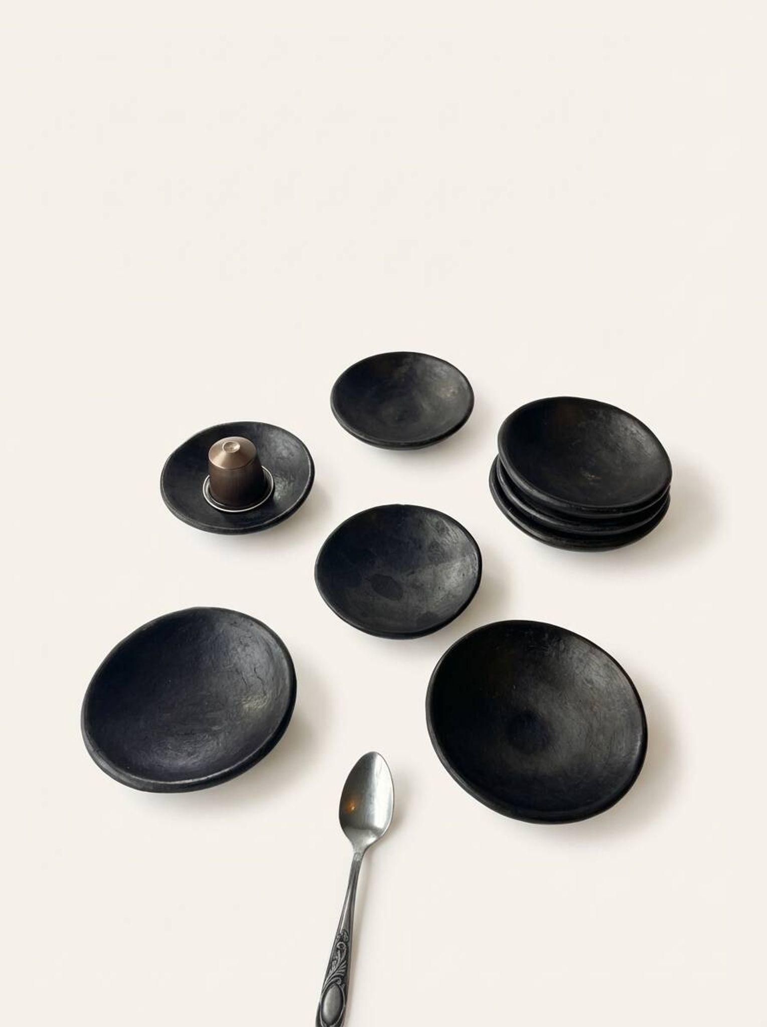 Two smoked terracotta bowls—for mezze, spices, or Kanah sauces.