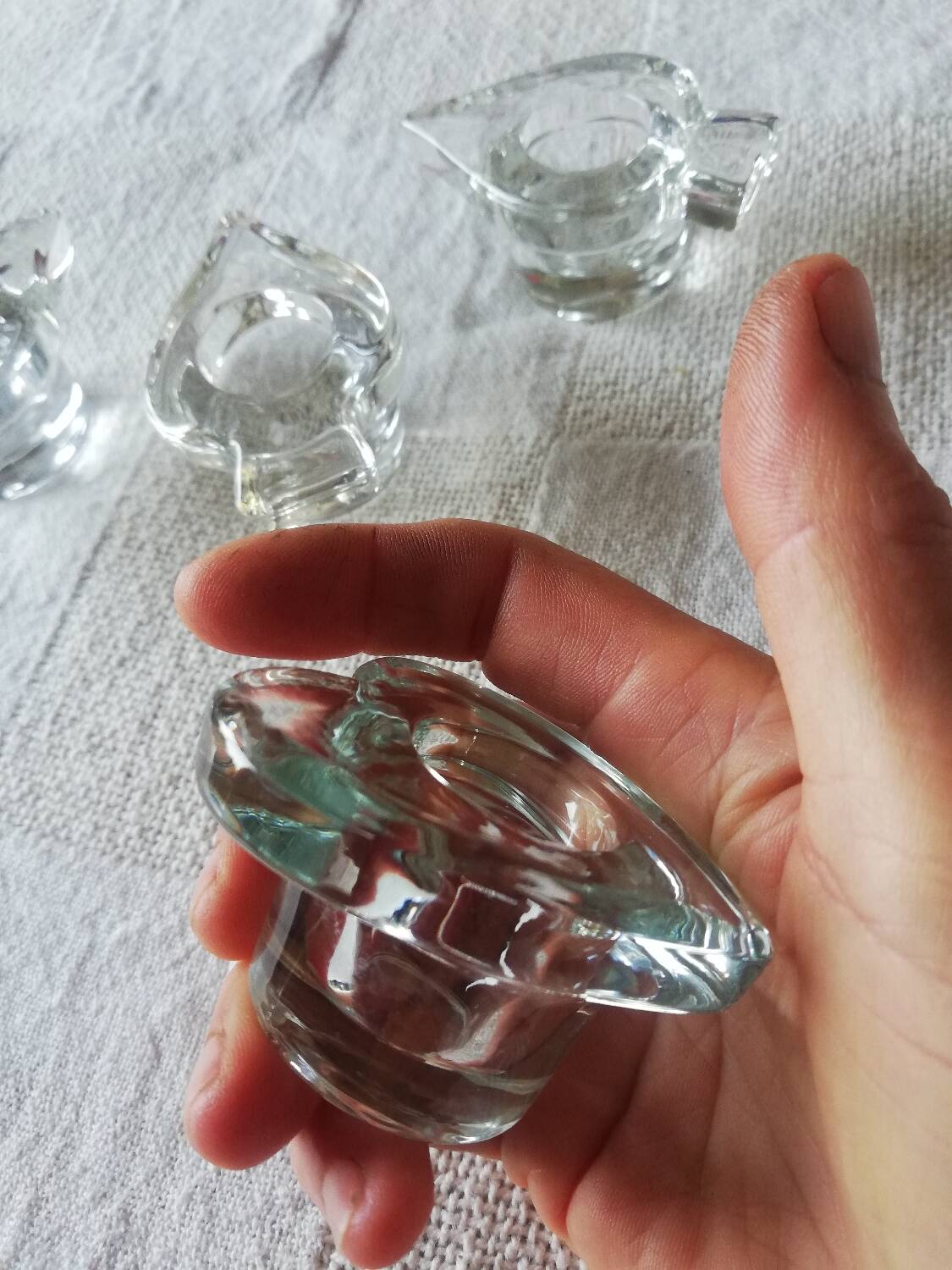 Set of four small transparent glass candle holders 3 spikes 1 heart