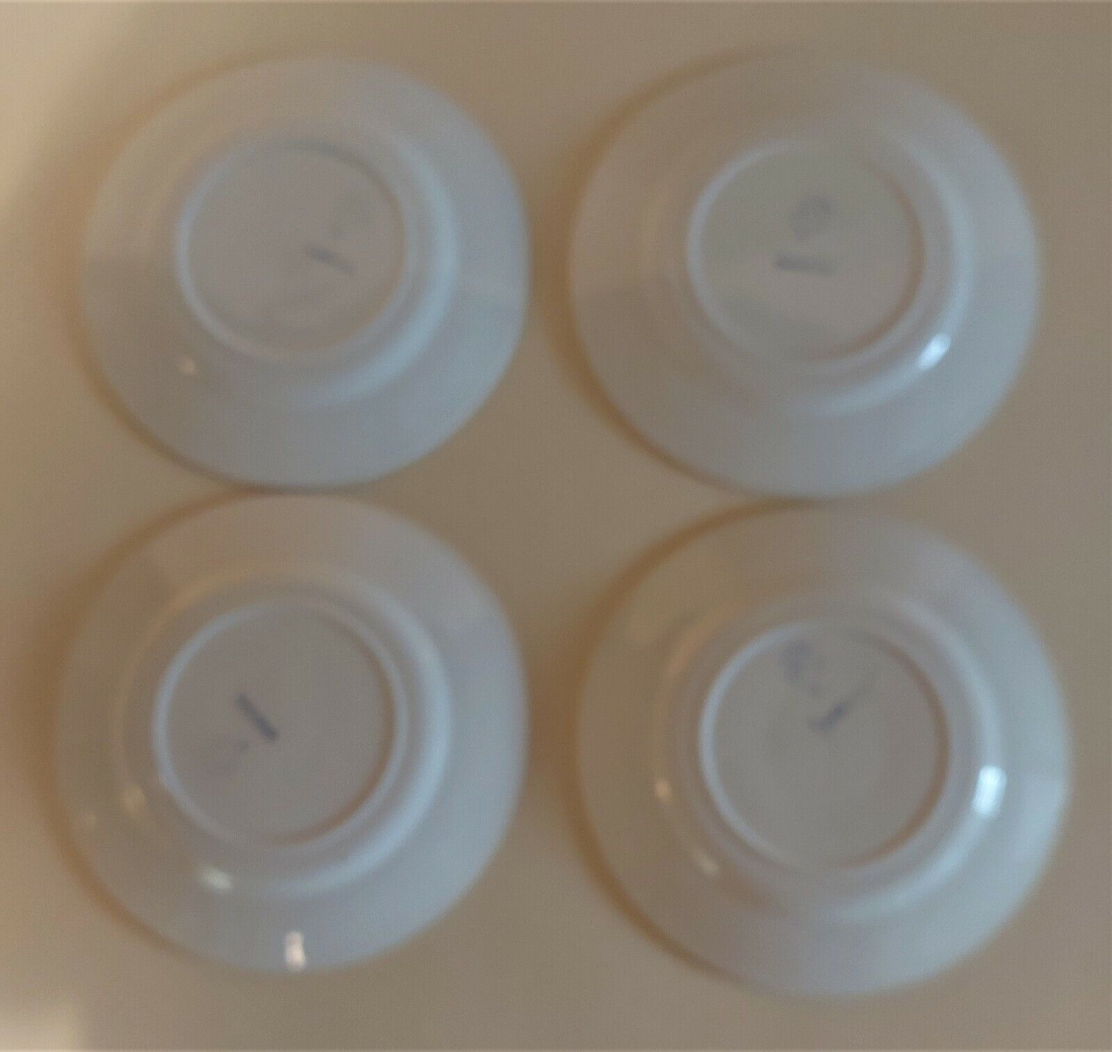 Series of four dessert plates in earthenware Saint Amand décor Rosettes
