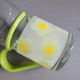 Pair of glass teacups with plastic handles