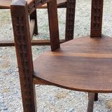 Set of three brutalist tripod armchairs in carved solid oak