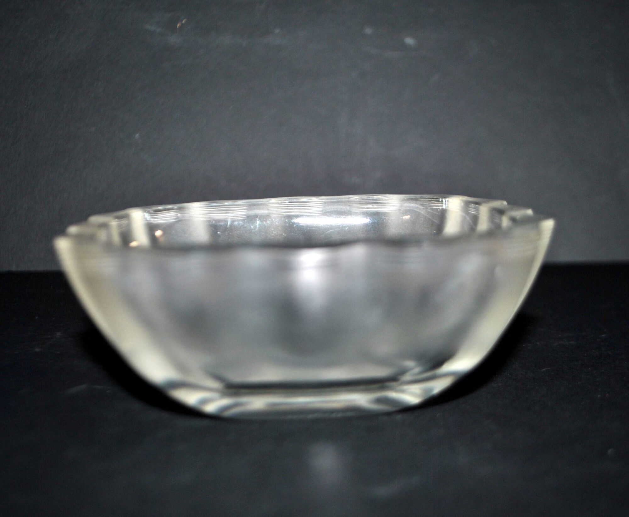 Lalique glass ashtray bowl with frosted finish, engraved with wave design, signed Lalique.