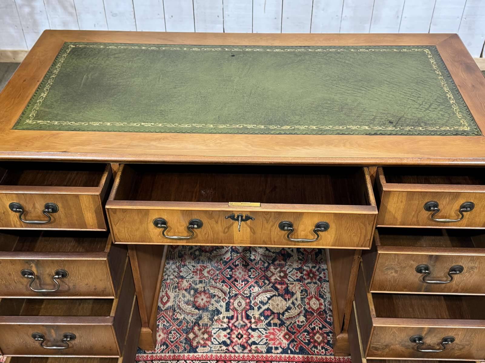 English flat desk with drawers from the 1970s in fir and leather top.