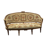 Sofa in walnut with basket shape from the Louis XVI period circa 1780