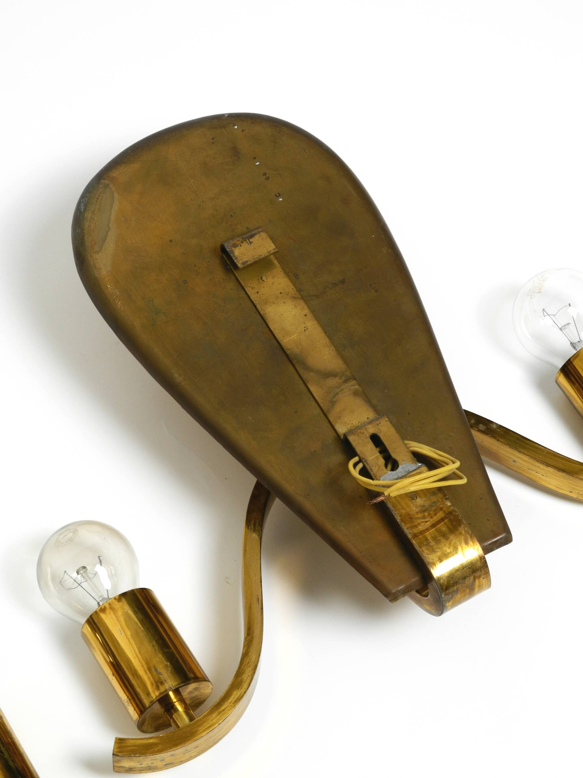 Pair of large heavy Mid Century brass wall lights from a German church