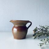 Old pitcher in glazed terracotta