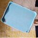 Small vintage bedside table in azure blue patina.