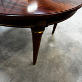 Extendable mahogany round table in Louis XVI style