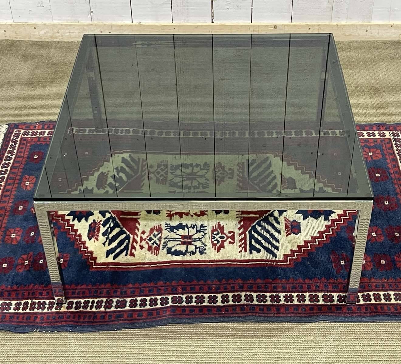 Chrome coffee table with a glass top from the 1980s.