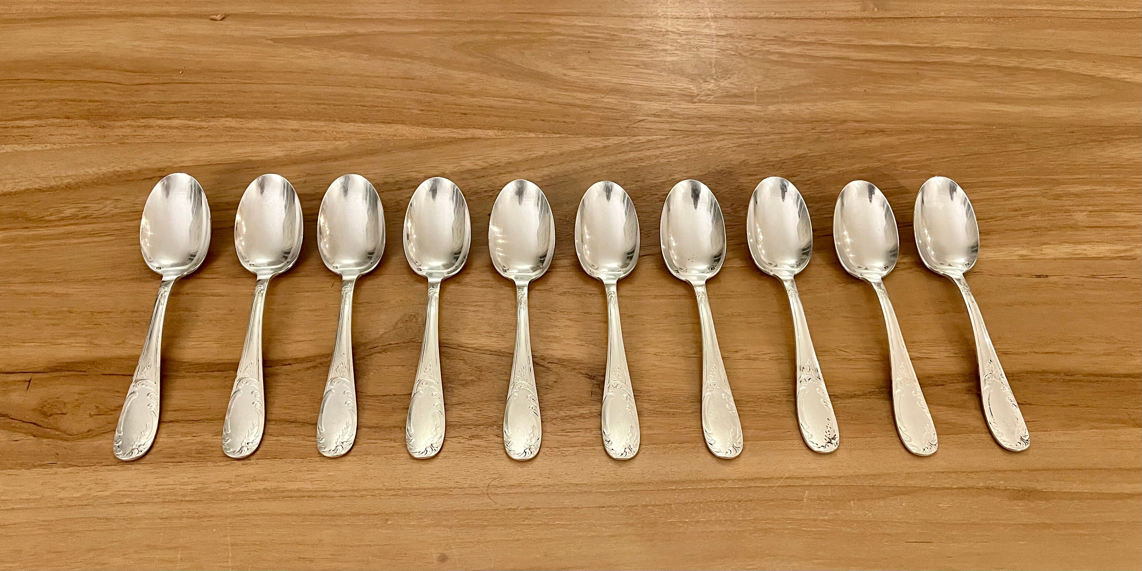 Set of 10 small silver metal spoons