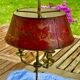 Bronze-gilt bouillotte lamp XIXth century with a tin shade featuring Japonese decoration.