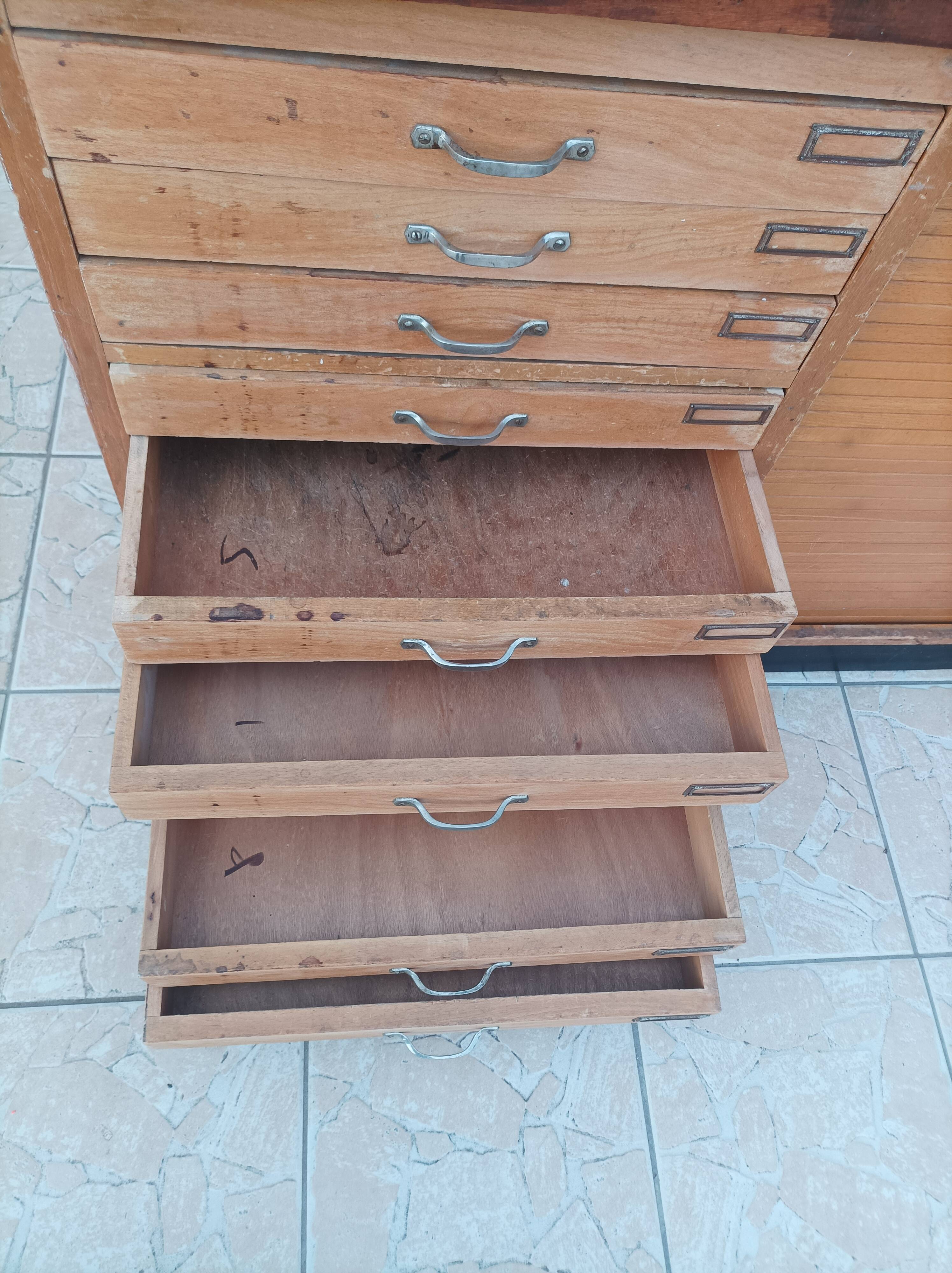 Workshop furniture with drawers and curtain in beech and walnut.