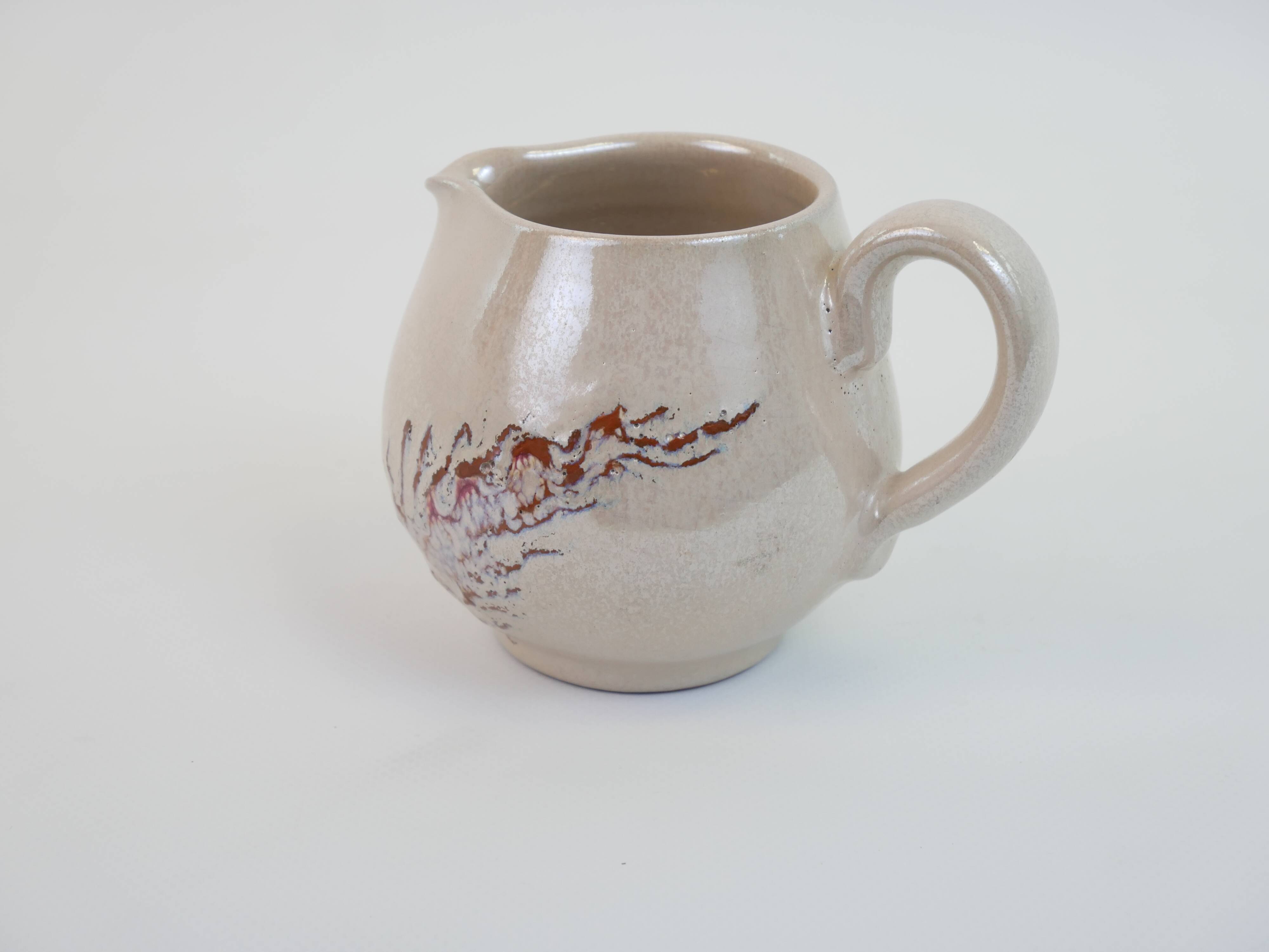 Pair of ceramic milk jugs signed La Roue Vallauris