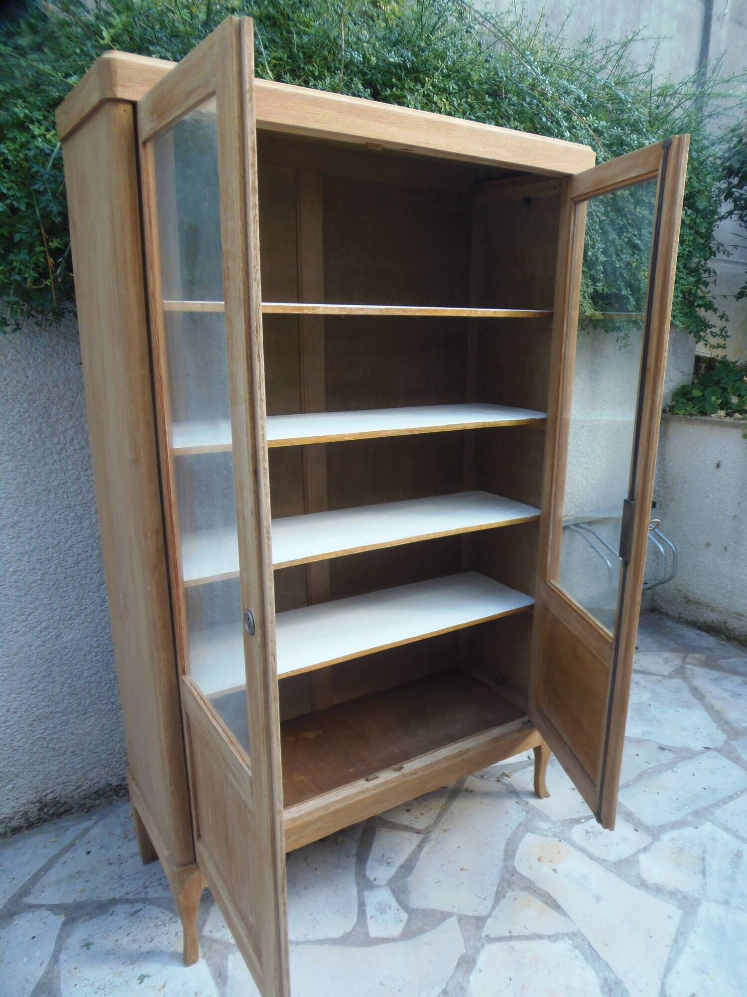 Charming vintage display cabinet from the 1950s in natural wood.