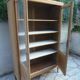Charming vintage display cabinet from the 1950s in natural wood.