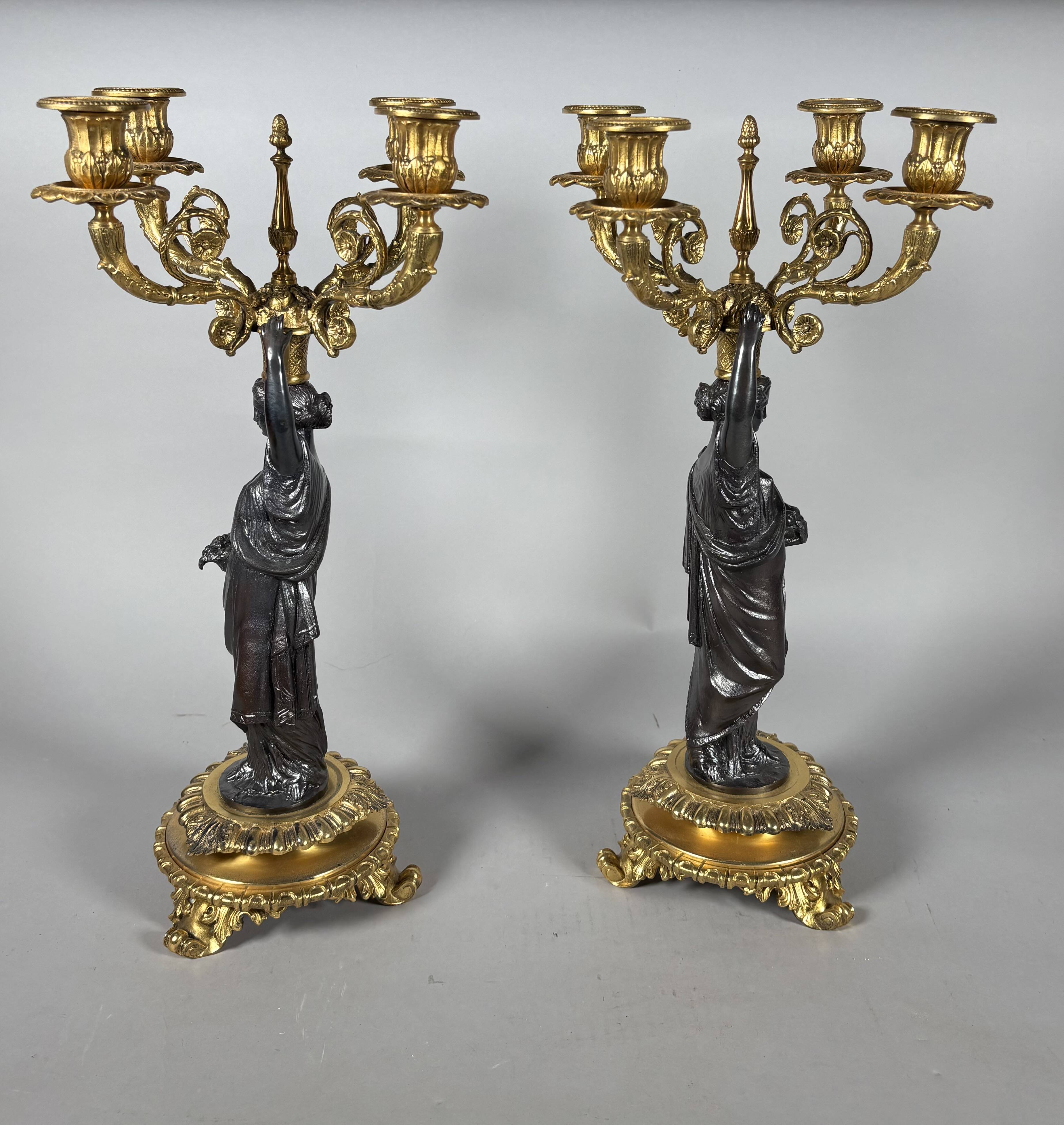 Pair of candelabra with women in the antique style of Napoleon III.