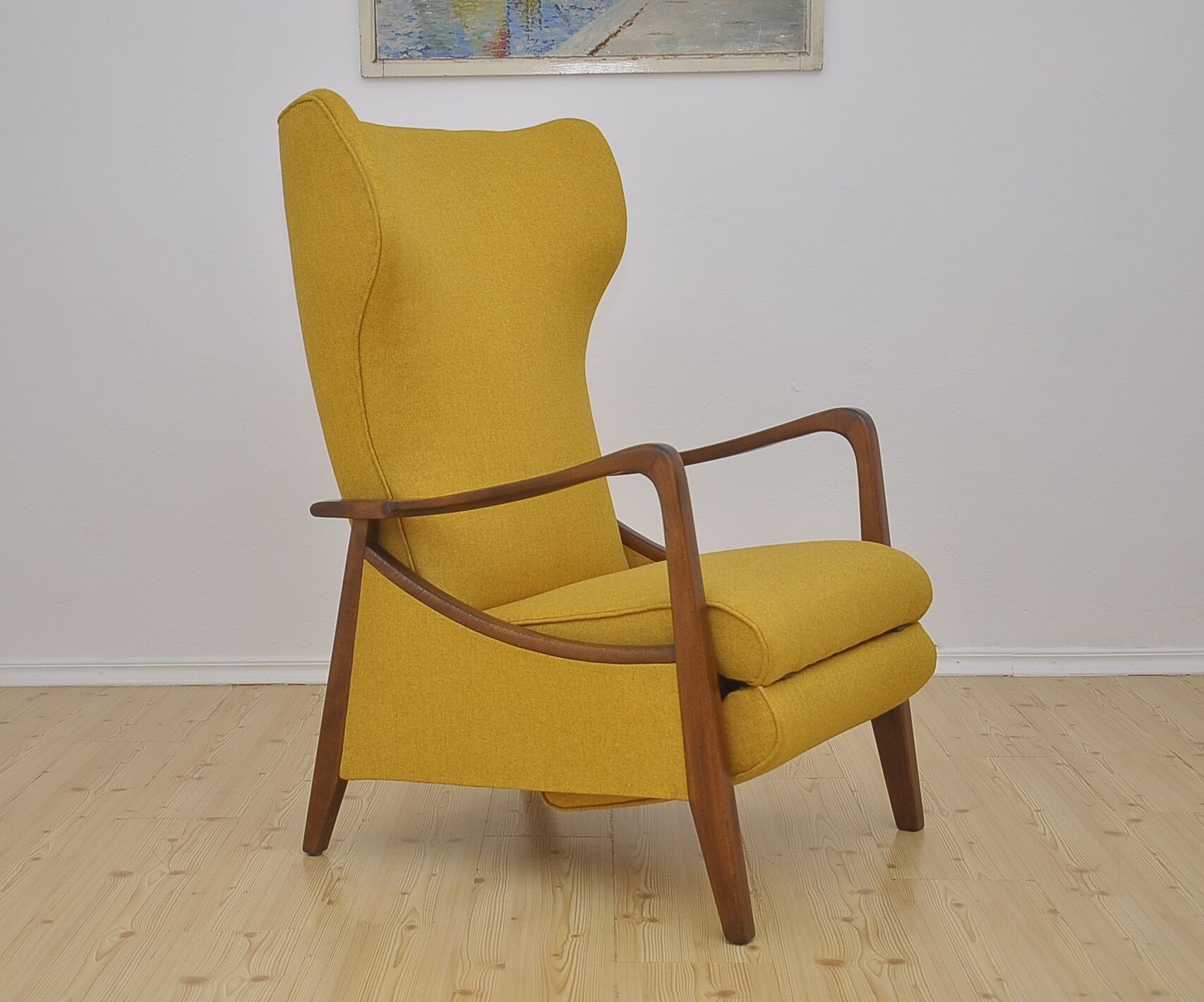 Mid-century Wingback armchair with folding footrest, 1960s