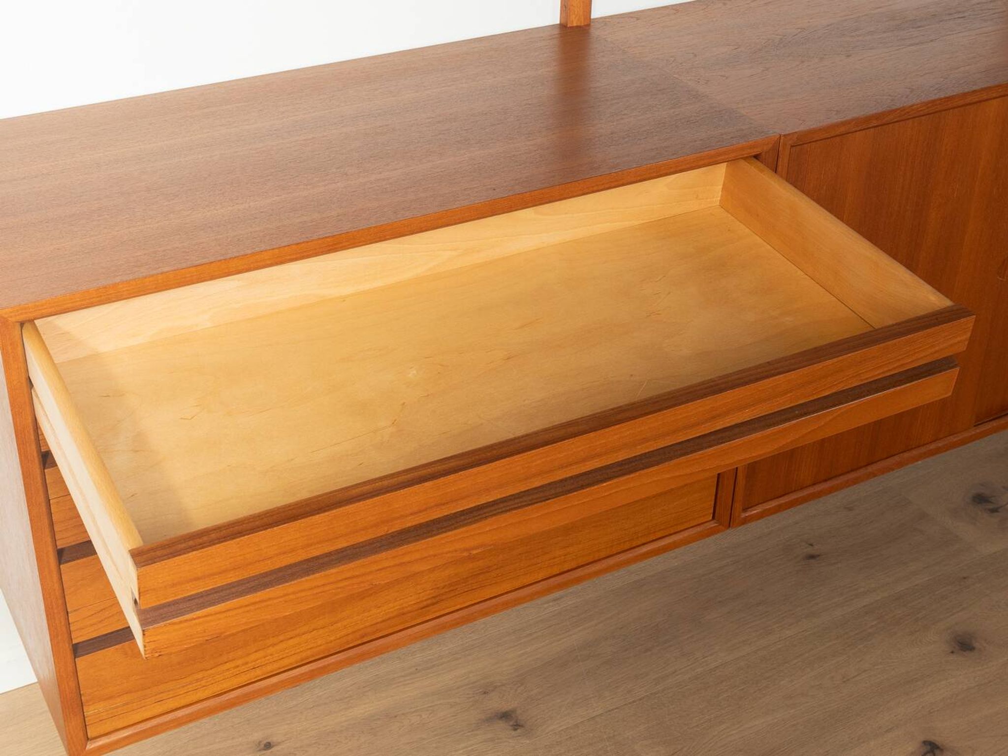Classic shelving system from the 1960s in teak veneer by Poul Cadovius for Cado