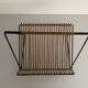 Mid-century black metal and rattan magazine rack, 1960, Italy