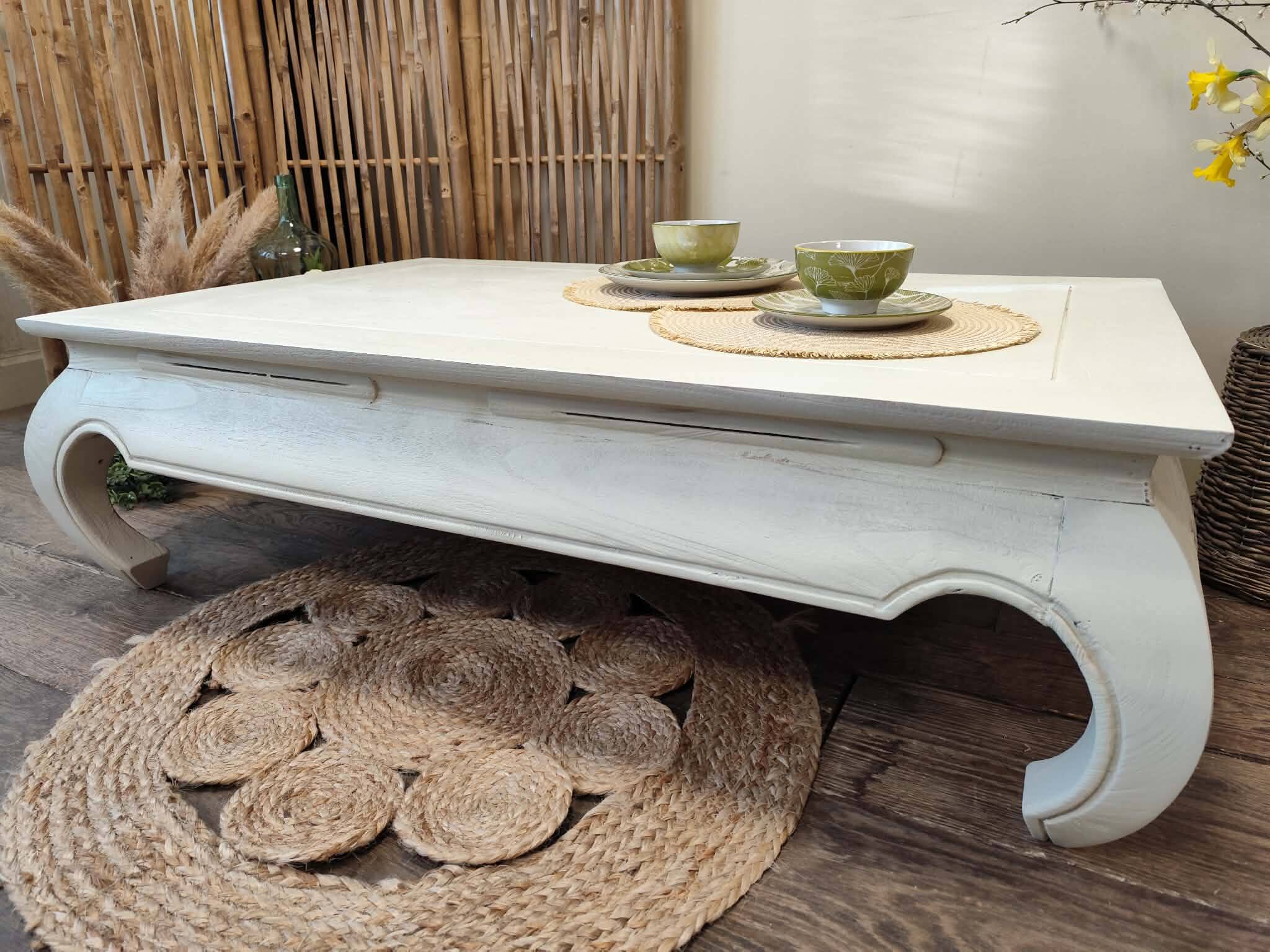 Exotic wood coffee table with its safety glass protection.