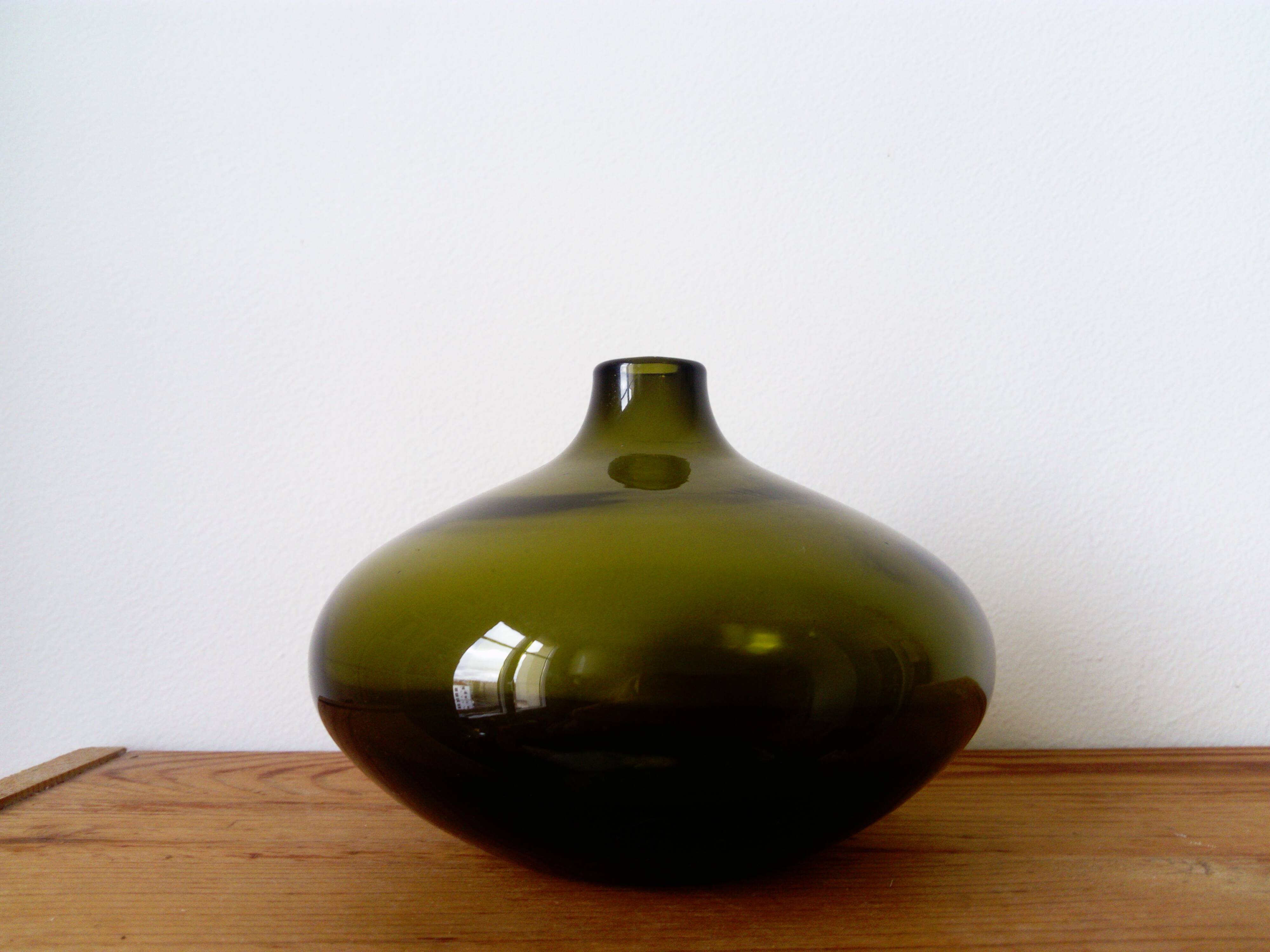 Small dark green handmade glass ball vase