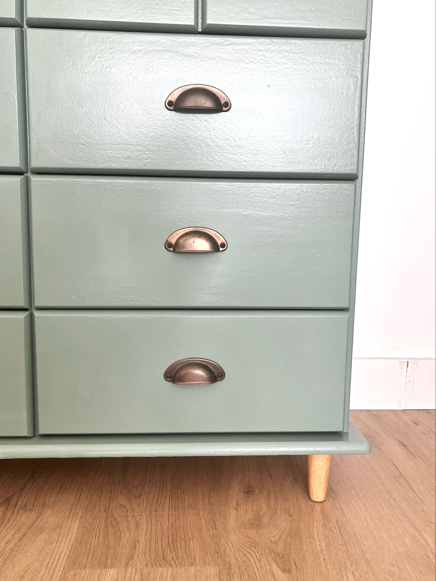 Low buffet with patinated gold handles.