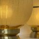 Pair of large art deco globe table lamps with brass legs
