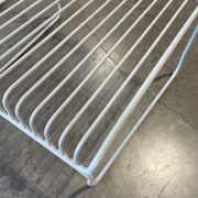 Many handcrafted wrought iron chairs