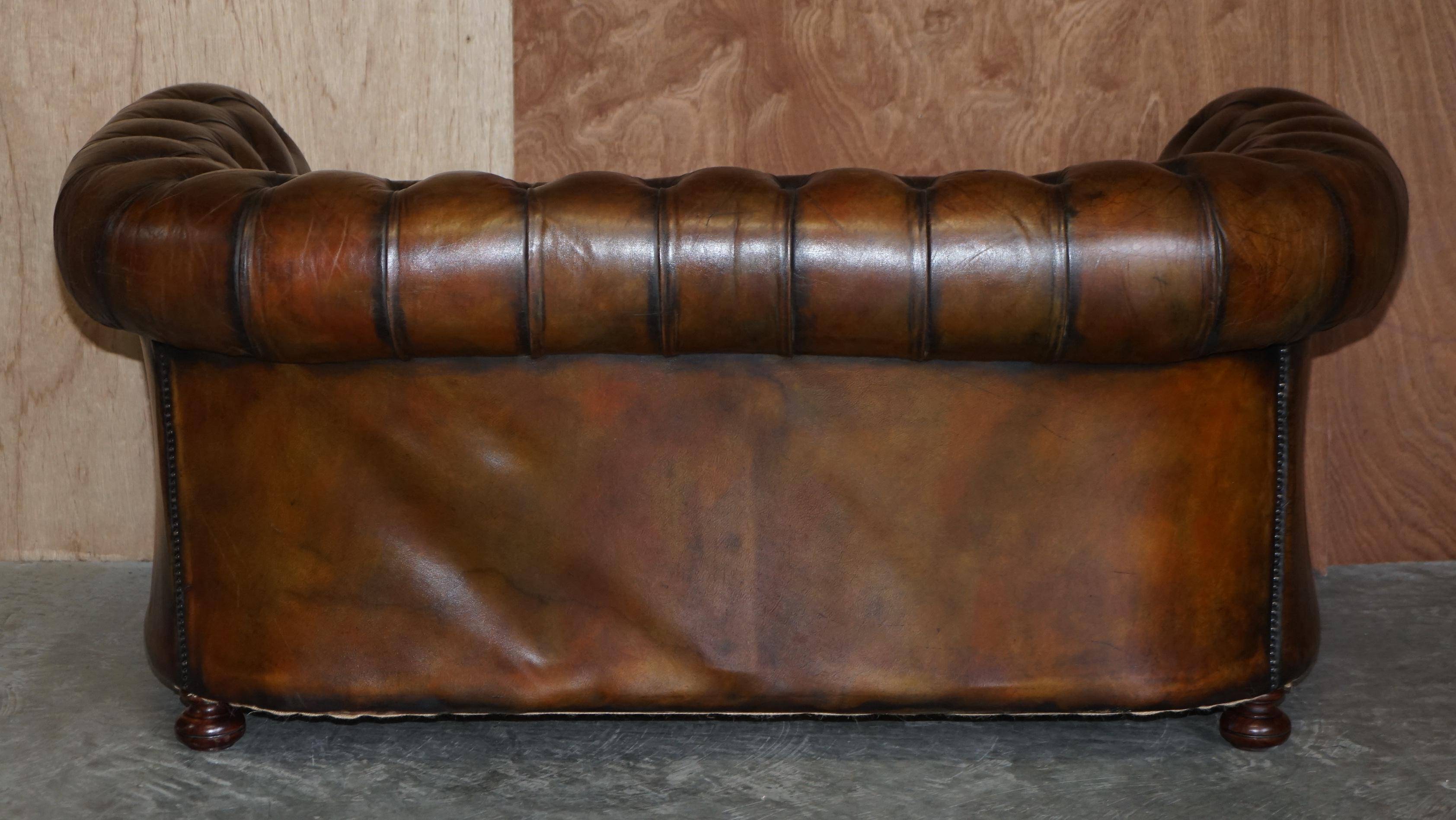 Restored leather Chesterfield sofa, walnut legs.