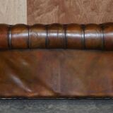 Restored leather Chesterfield sofa, walnut legs.