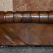 Restored leather Chesterfield sofa, walnut legs.