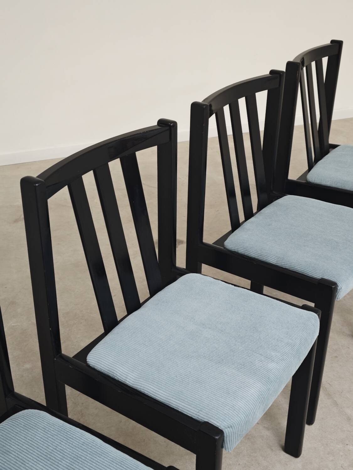 Set of 4 modernist black chairs with light blue ribbed fabric