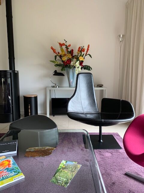 Moroso Fjord armchair with its pouf, design Patricia Urquiola 2002, steel and smooth black leather