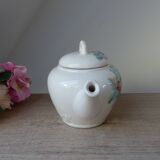 Old ceramic teapot in the shape of a basket of fruits from the garden