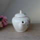 Old ceramic teapot in the shape of a basket of fruits from the garden