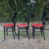 6 vintage Baumann seagull model chairs, black lacquered with red Skai seats.