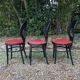 6 vintage Baumann seagull model chairs, black lacquered with red Skai seats.