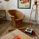 Braided wicker armchair