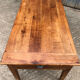 Antique cherry farmhouse table with 2 drawers and 1 pull-out