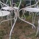 Mategot-style perforated wrought iron garden furniture with table and armchairs