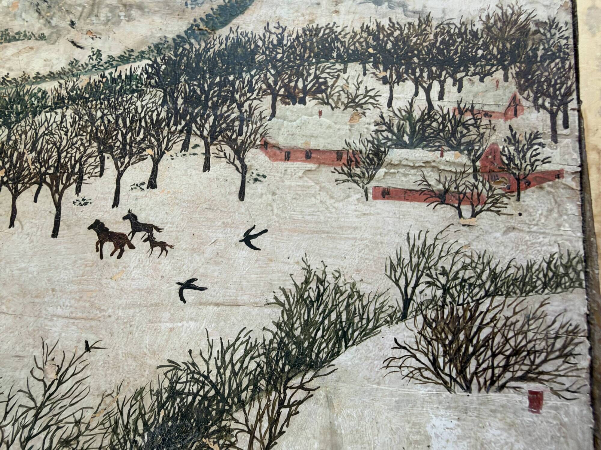 Antique chest hand-painted with a snowy village scene and a starry interior.