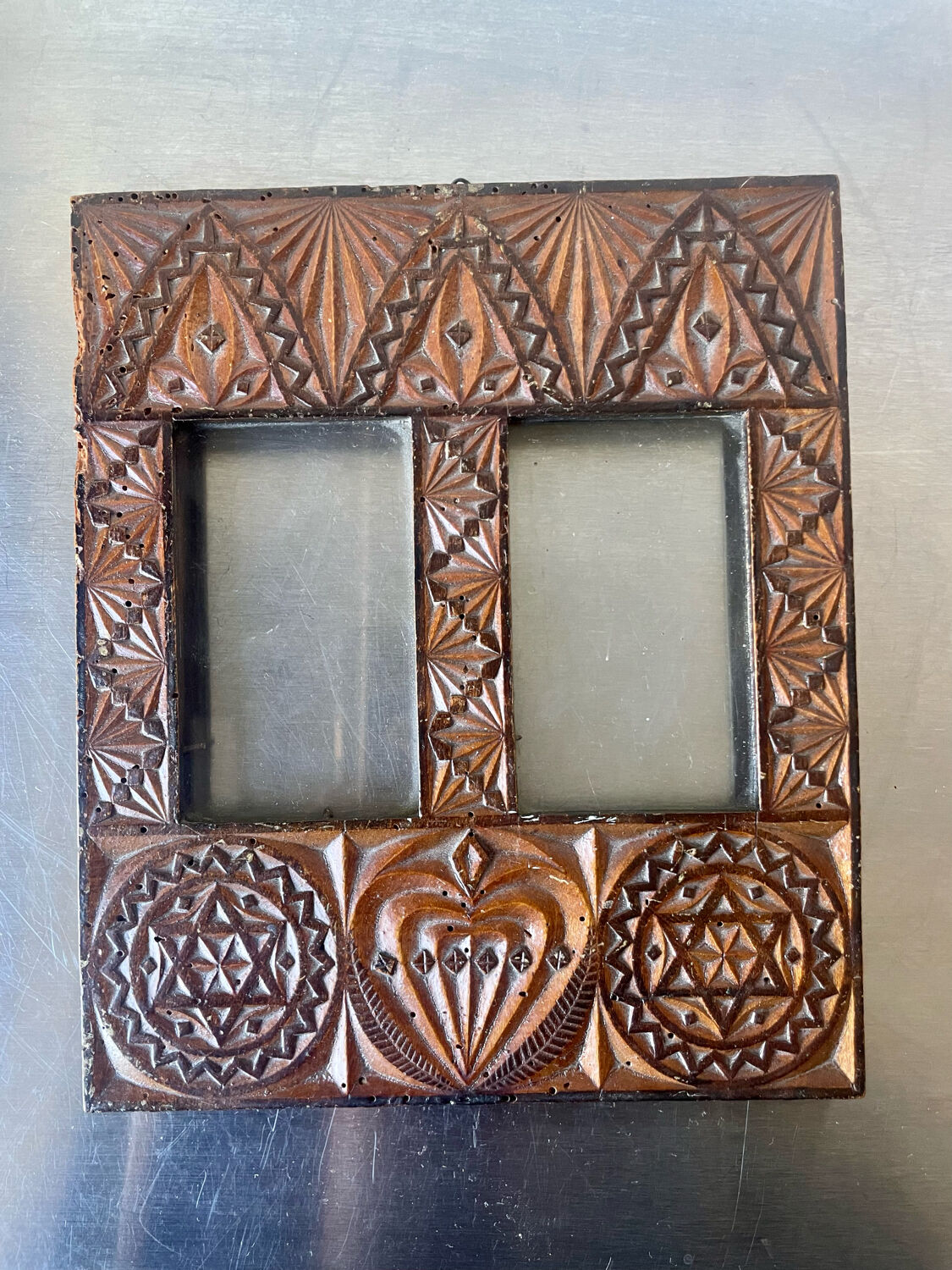 Double frame intricately carved wood