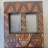 Double frame intricately carved wood