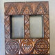 Double frame intricately carved wood