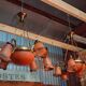 Pair of Art Nouveau style chandeliers in bronze and orange glass paste.