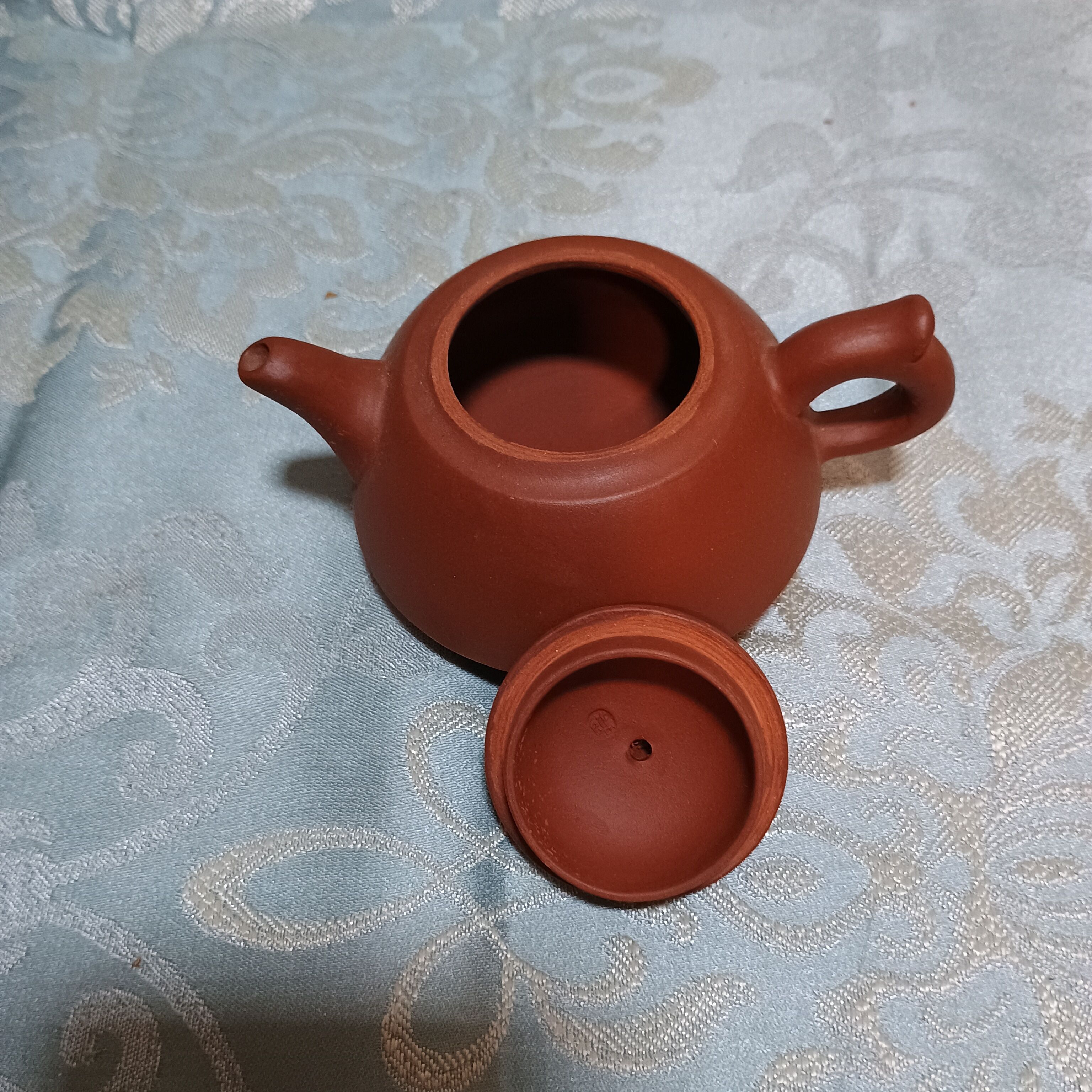 Yixing teapot in signed red clay