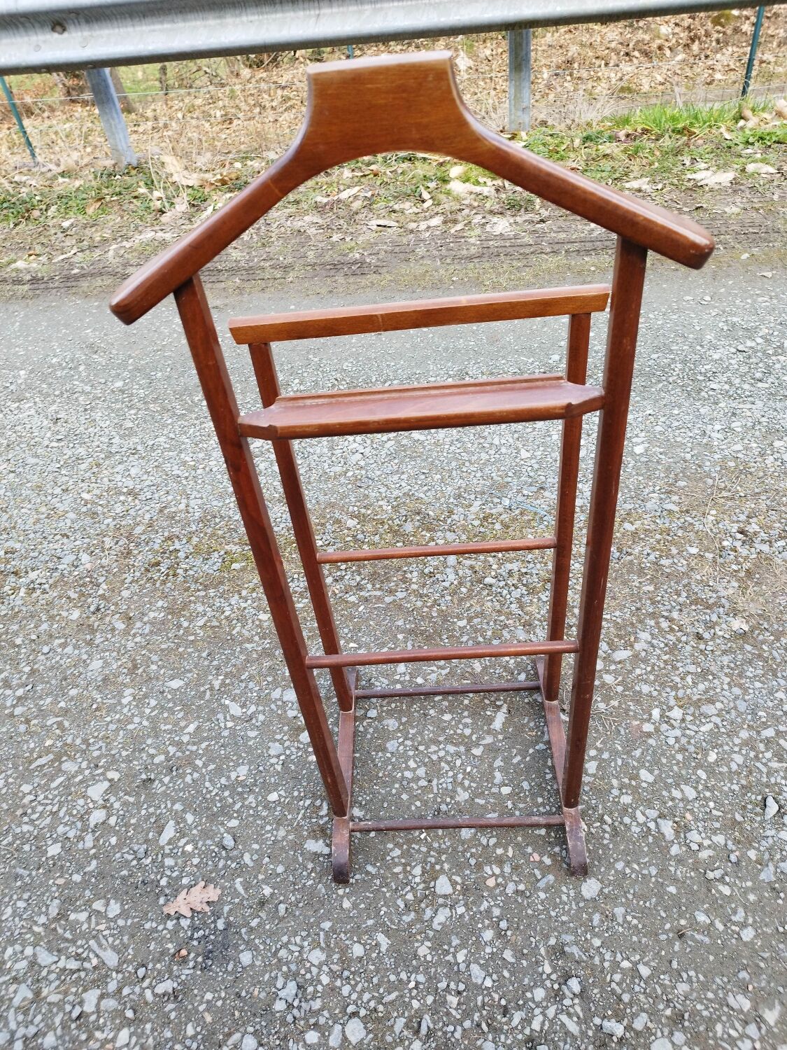 Valet wearing double wood coat rack