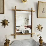 Mirror in gilded stucco, bamboo patina and gold leaf.